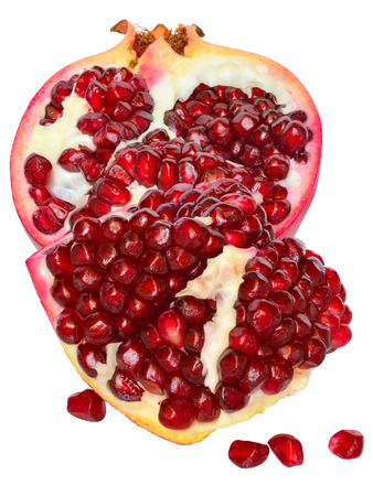 Cut the pomegranate with grain isolated on white background.の写真素材