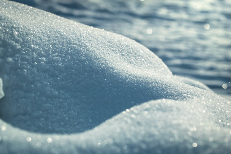 Macro background of fresh snowflake texture on a blur.の写真素材