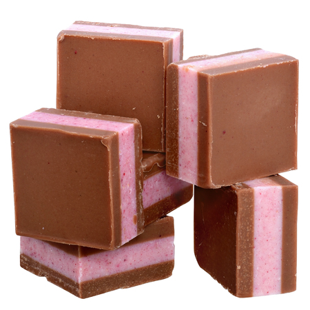 Dark chocolate cubes with fruit berry cream filling isolated on a white background.