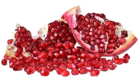 Cut the pomegranate with scattered grain isolated on white background.