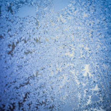 Frosty natural pattern on winter windowの写真素材