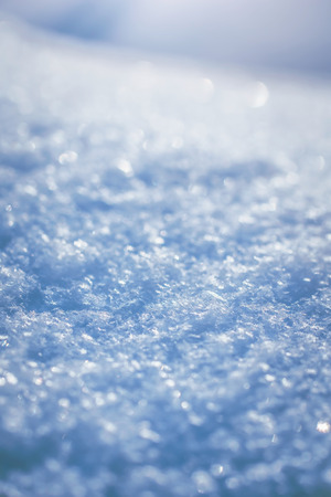 Macro background of fresh snowflake texture on a blur.の写真素材