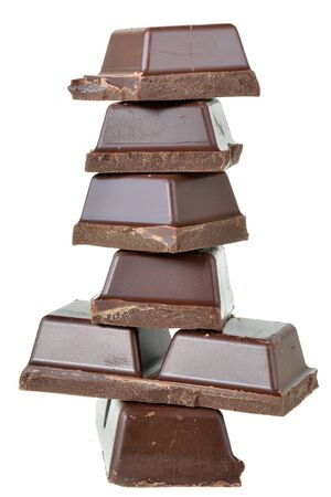 Cubes of chocolate isolated on a white background.の写真素材