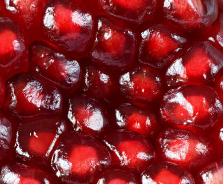 pomegranate with scattered grain close-upの写真素材