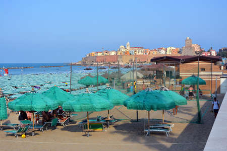 Termoli, Molise, Italy - 08/26 / 2019- The sand beach with the old fishing village on background.のeditorial素材