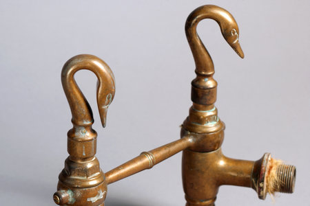 Antique copper faucet with swan shapeの写真素材