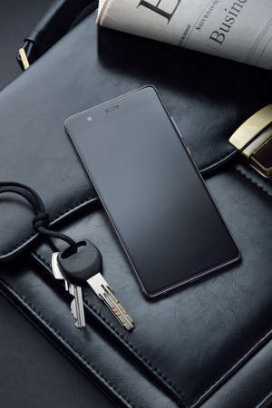 a mobile phone on which to insert work or business informationの写真素材