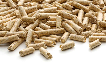 Wood pellets fuel on a white background with a very perspective view.の写真素材