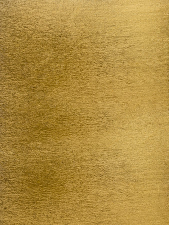 Surface of a sheet of gold leaf for graphic arts.の写真素材