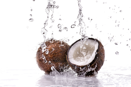 wet coconuts to an overflowing cascade of fresh liquidの写真素材