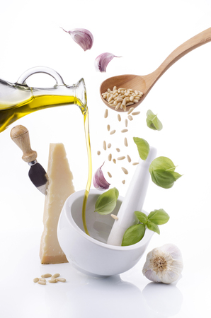 the ingredients for Genoese pesto poured into a ceramic mortarの写真素材