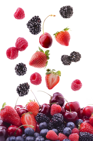 collection of mixed fresh fruit with raspberries, cherries, blackberries, strawberries and blueberriesの写真素材