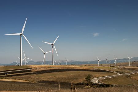 renewable energy and environmental impact. Countryside with wind generatorsの写真素材