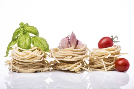 Pici, traditional Italian rustic pasta from the Tuscany region with raw ingredientsの写真素材