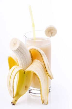 fresh smoothie with banana in drinking glass isolated from the white backgroundの写真素材