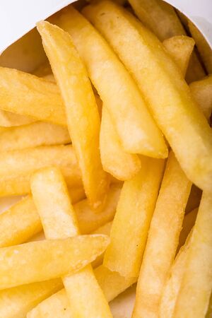 fried potatoes in the foreground cut into strips