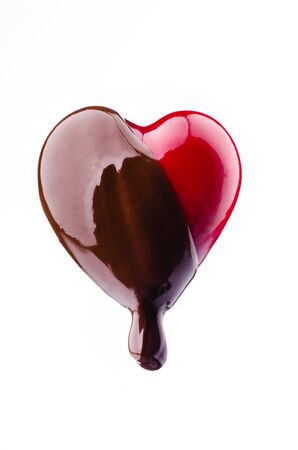 a heart-shaped shape covered with melted dark chocolateの写真素材