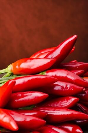 in the foreground a bunch of cayenne chiliの写真素材