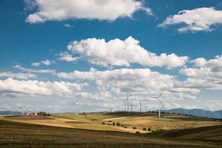 solar countryside landscape with wind generators