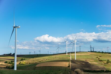 solar countryside landscape with wind generators