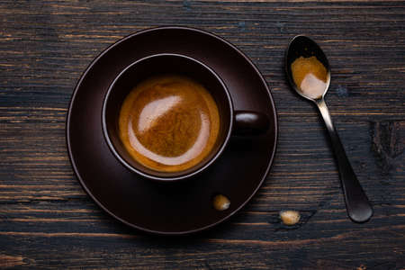 on the rustic wooden background, tasty and creamy Italian espresso in the cupの写真素材