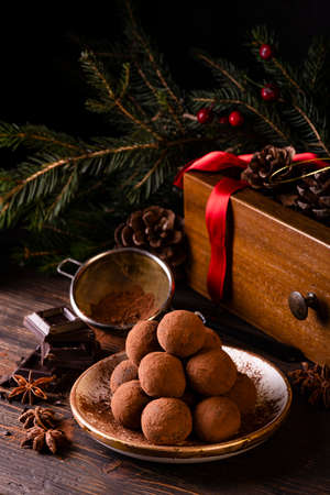 chocolate truffles, with spices and Christmas decorations. Christmas compositionの写真素材
