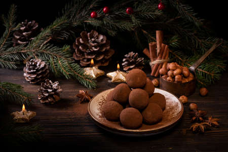 chocolate truffles, with spices and Christmas decorations. Christmas compositionの写真素材