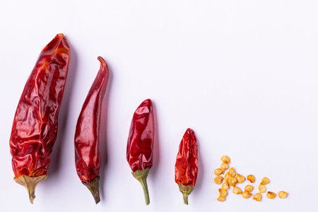 close-up view, hot and dry chili pepper on isolated white backgroundの写真素材