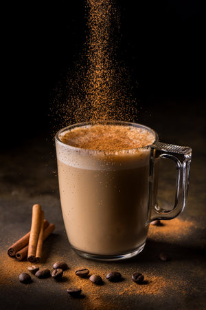 in the foreground, a glass with coffee and a vegetable drink flavored with ground cinnamonの写真素材