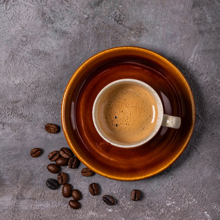 espresso coffee in cup, top view on gray textured backgroundの写真素材