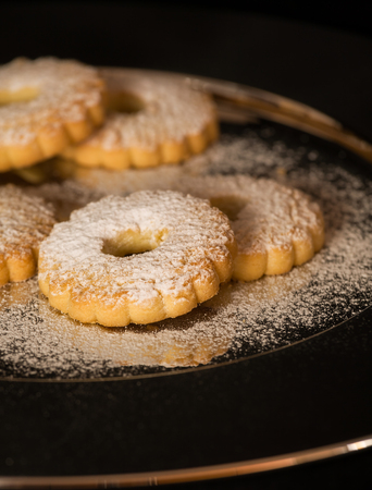 Five biscuits canestrelli on a plate of steelの写真素材