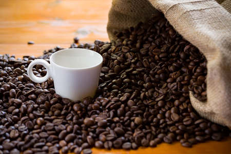 Coffee beans burlap and cup of coffeeの写真素材