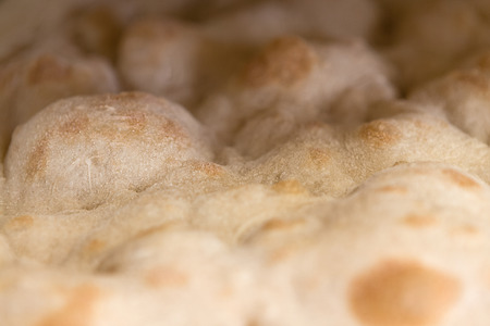 Closeup of focaccia romana bread without ingredientsの写真素材