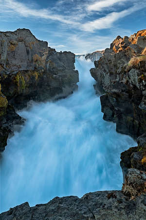 Hlauptungufoss waterfall in a sunny day, Iceland