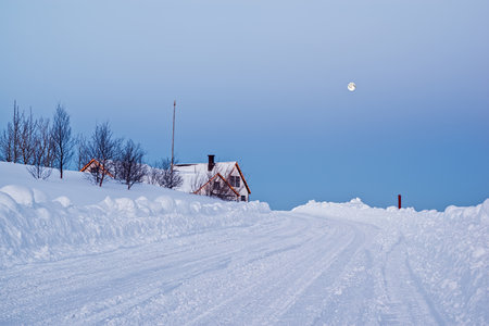 Sunrise in Heidmork lake during a snowy winter and moon, Icelandの写真素材
