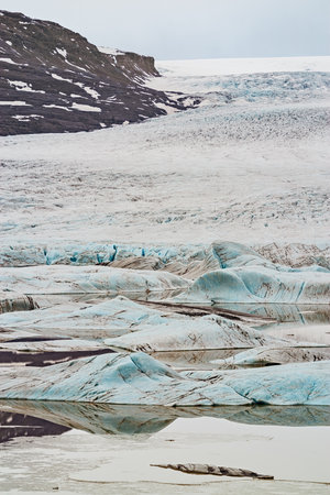 Hoffellsjokull glacier and lagoon in Iceland in a cloudy dayの写真素材