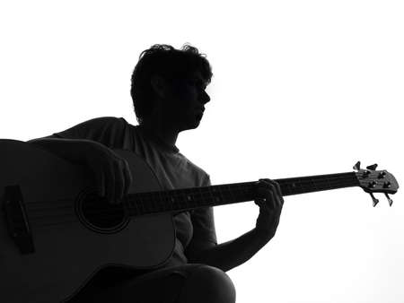Silhouette from a woman and a guitarの写真素材