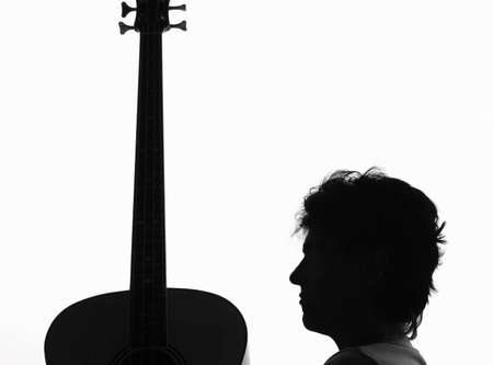 Silhouette from a woman and a guitarの写真素材