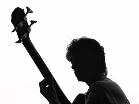 Silhouette from a woman and a guitarの写真素材