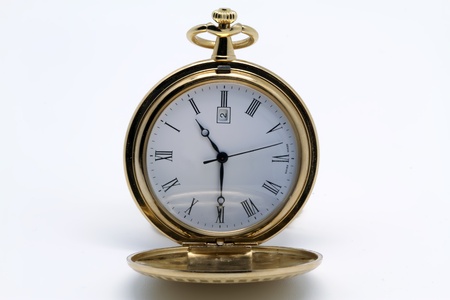 gold pocket watch on white backgroundの写真素材