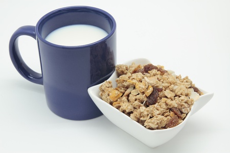 blue mug of breakfast with milk and cerealsの写真素材