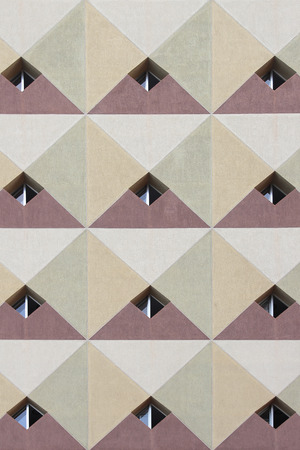 detail of a facade with diamond-shaped windowsの写真素材