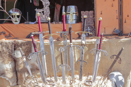 outdoor scene with some ancient medieval swordsの写真素材