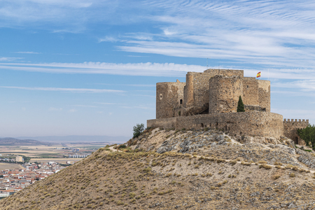 horizontal view of castle of la Muela in the spanish municipality of consuegra, castilla la mancha on a summer day with blue cloudy skyのeditorial素材