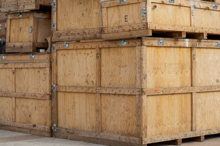 foreground in horizontal view of some large wooden boxes stacked for transportation artworks and...