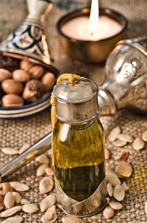 Still life of argan oil with fruits and moroccan objectsの写真素材