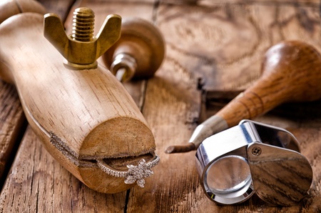 Still life of goldsmith's tools with diamonds ringの写真素材