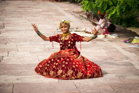 Jodhpur, India-August 16, 2008: unidentified richly dressed dancer welcomes people at the entrance of Jaswant Thada, in Jodhpur. Jaswant Thada is a royal cenothaph built for Maharaja Jaswant Singh IIのeditorial素材