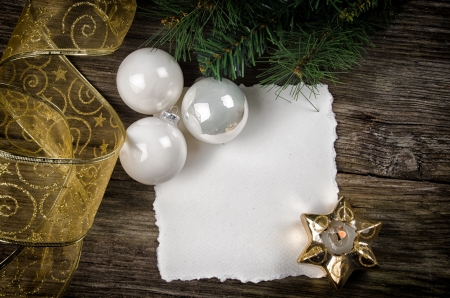 Christmas greeting card with ornaments and candleの写真素材