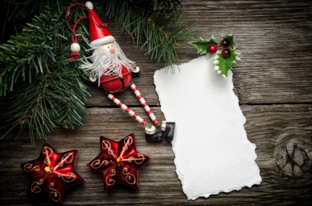 Greeting card for Christmas with Santa Claus decoration and candlesの写真素材
